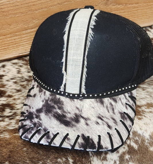 One-of-a-kind black snapback with white center stripe and cowhide-patterned bill