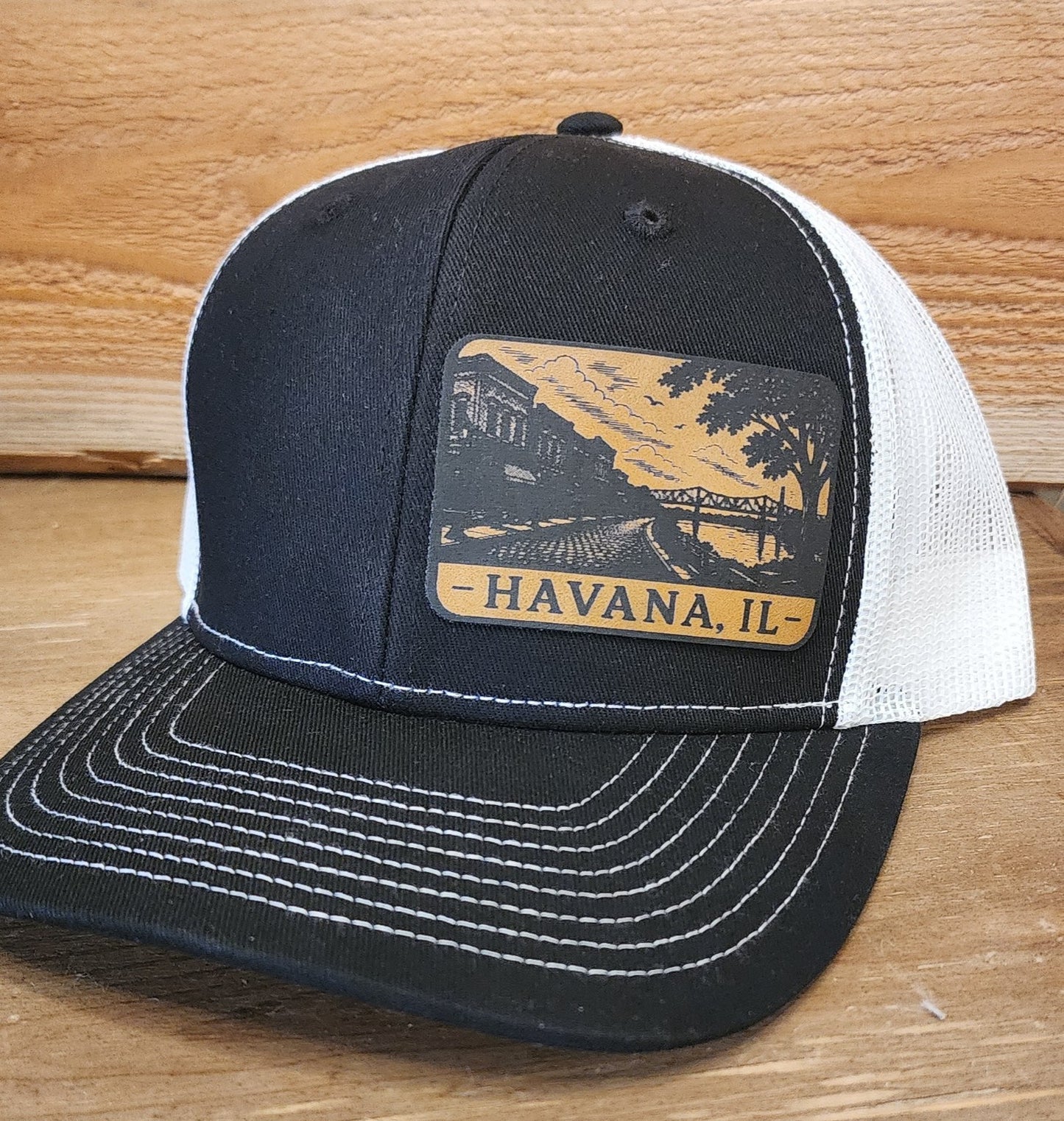 Black and white adjustable snapback with custom Havana, IL patch
