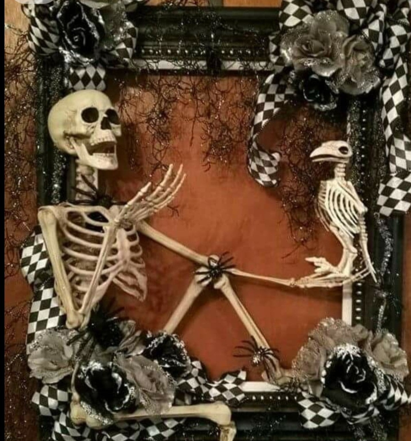 Spooky Wreath Workshop example with skeleton and bird in black and orange frame