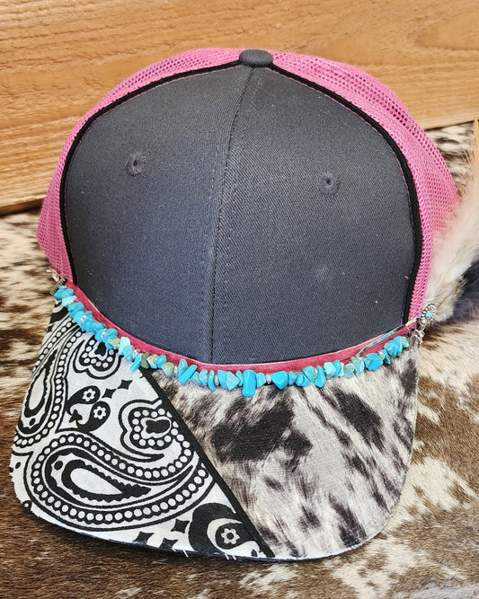 Front view of one-of-a-kind turquoise and feather handcrafted snapback hat